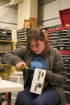 Laura Repairs Motor Box